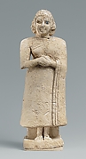 Standing female worshiper