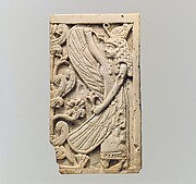 Plaque with a winged female and a sacred tree