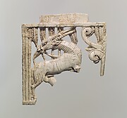 Openwork plaque with an oryx eating a plant beside a tree