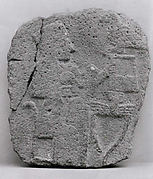 Relief: woman seated at a table