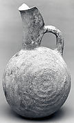 Spouted jug with raised concentric circles
