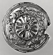 Roundel with a rosette and recumbent horned animals