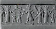 Cylinder seal and modern impression: war goddess flanked by goddesses with Egyptian-style sun-disk headdress and vertical wings