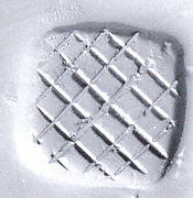 Loop (?) handled rectangular stamping device