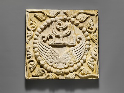 Wall panel with wings and a Pahlavi device encircled by pearls