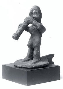 Figure of man blowing trumpet