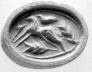Scaraboid seal in form of human head and galloping horse