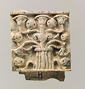 Plaque with a tree of intertwined papyrus and pomegranates; craftsman's mark on the lower tenon