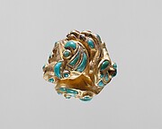 Pommel in the shape of coiled animals