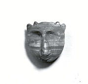 Demon-headed amulet