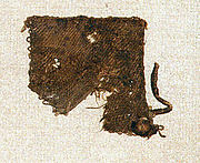 Small textile square with leather tie in corner