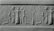 Cylinder seal: mistress of animals flanked by rampant horned animals