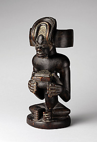 Commemorative figure of a chief playing a sanza (thumb piano)