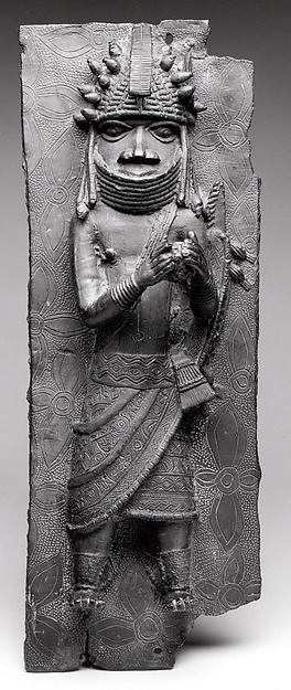 Plaque: Titleholder with Calabash Rattle