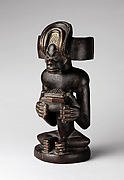 Commemorative figure of a chief playing a sanza (thumb piano)