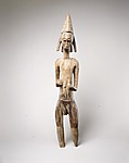 Male Figure Holding Animal Horn