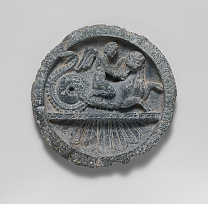 Schist dish with Eros riding a lion-headed sea monster