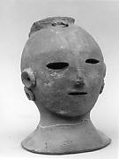 Head of a Female Haniwa Figure with Headdress and Earrings
