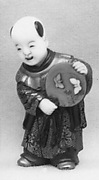 Netsuke of Boy with a Fan