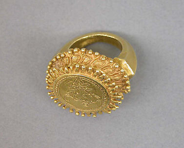 Stirrup-shaped Ring with Circular Bezel with Inscribed 
