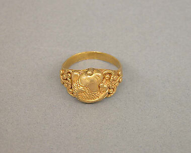Ring with Oval Bezel and Raised Design of Fish