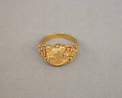Ring with Oval Bezel and Raised Design of Fish