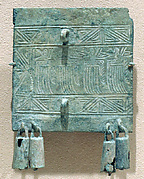 Flat Plaque with Bells and a "Feather Man" in Rowing Position