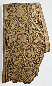 Plaque Decorated with Vine Scroll Springing from a Vase