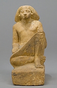 Statue of an asymmetrically seated man