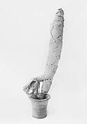 Jar and rod holding wrappings in the shape of an animal corpse (Imiut)