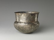Bowl with flutes f rom shoulder to rosette at base and with inscribed weight