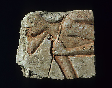 Relief with a stooped workman