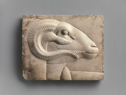 Relief plaque with ram's head from a god's figure