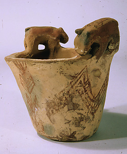 White cross-lined ware beaker with hippos