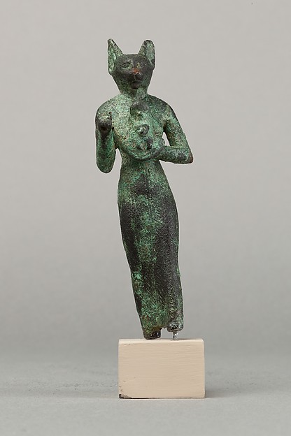 Bastet, a scarab between her ears, holding an aegis