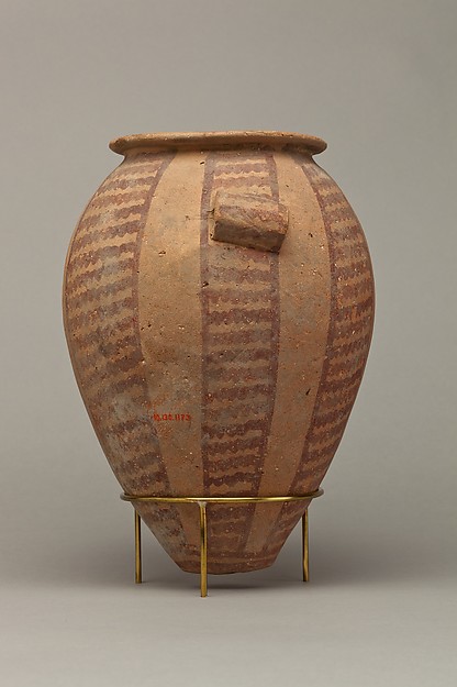 Decorated ware jar with vertical bands of wavy lines