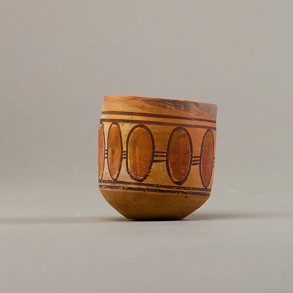 Cup with geometric decoration
