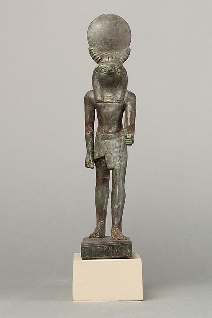 An ancient base asking blessings from Heka for the Scribe of the Library of Atum Pa-kap, son of the Prophet of Atum Pa-iry-kap and the mistress of the House Hr-ib-Wadjet; above the ankles the statuette is brass and therefore modern