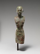 Kushite priest wearing garment with leopard's head and tassels, subsequently adapted for a king