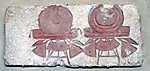 Relief with necklaces on stands