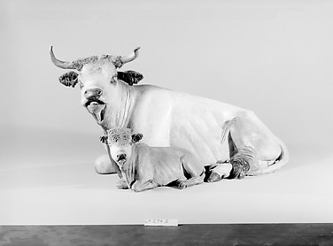 Cow and calf lying down