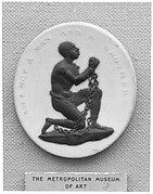 Chained negro kneeling