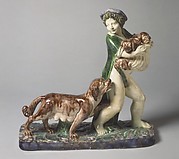 Boy carrying pups