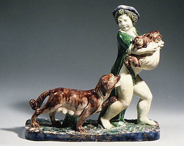 Boy carrying pups