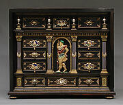 Cabinet with gold mounts and relief