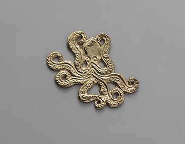 Reproduction of a gold octopus ornament