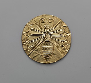 Reproduction of a gold disk with an embossed butterfly