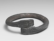 Silver bracelet ending in snake's heads