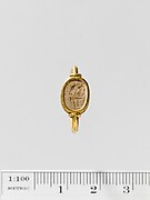 Steatite scaraboid seal set in a gold swivel ring