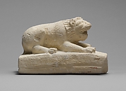 Limestone statuette of a lion